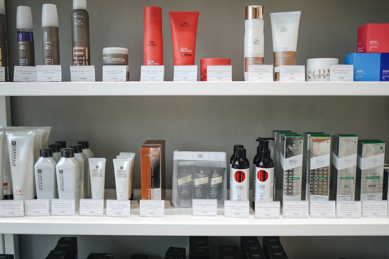 Assorted skincare and beauty products neatly displayed on shelves in a store setting.